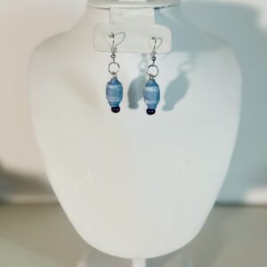 Blue the color of light-wash denim in a combo teardrop/barrel shape with silver fixings on a neutral background