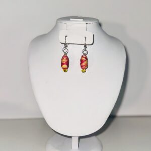Dangle earrings that are a deep orange-red with yellow swirled in.