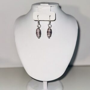 Earrings of gray shell look beads with a neutral background