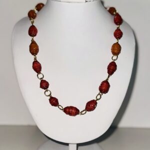 Orange paper beads in a chain necklace with gold fixings.