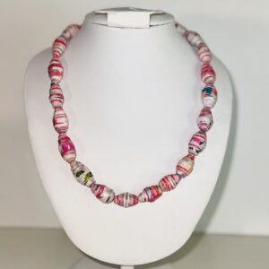 Necklace of bright pink and white paper beads.
