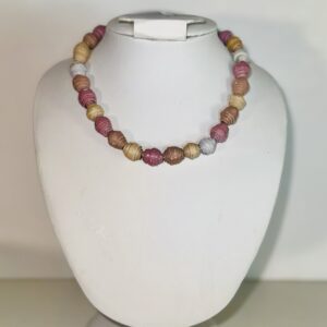 choker necklace made of small creamy colored beads in white, yellow, clay and pink.