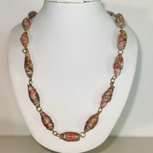 Necklace of orange, tan and green paper beads with gold fixings.