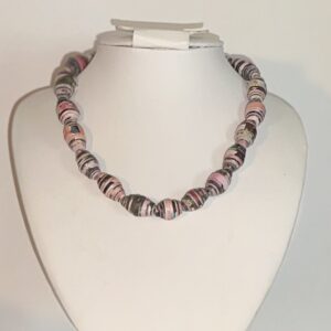 Pink & Black Striped Necklace on a white form with a neutral background