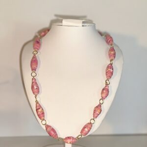 paper bead necklace with popcorn pink design and gold fixings on a white necklace form with a neutral background