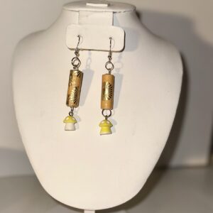 Earrings with silver fixings with yellow, orange and gold long cylinders atop yellow capped white mushrooms