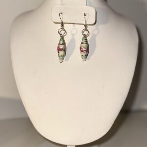 Teardrop earrings with beads that are white, blue, and swirling pink and black with silver fixings on a neutral background