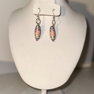 80's Color Cylinder Beads with silver fixings on a neutral background