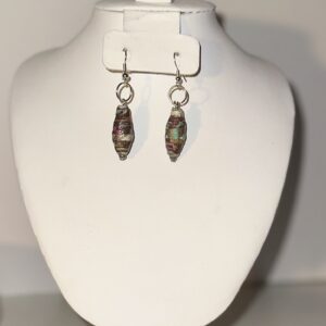 Venetian glass look dangle earrings of paper-based beads with white, brown, pink and blue swirling, with silver fixings on a neutral background