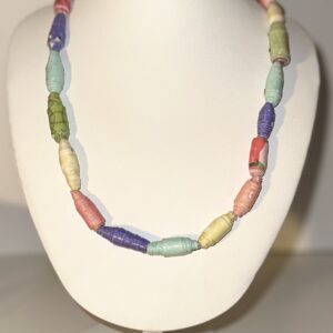 Rainbow colors of paper beads on a necklace form with a neutral background