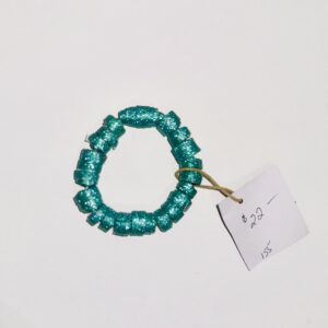 Blue Glitter bracelet on a black background