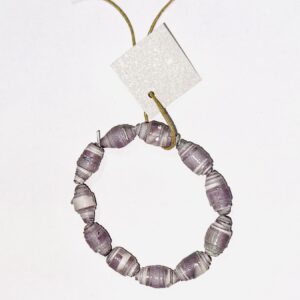 Shell coloring and look in a stretch bracelet on a neutral brown background