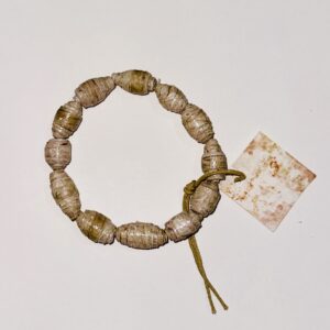 The paper beads on this stretch bracelet has a wood pattern. The piece is shown on a neutral brown background.