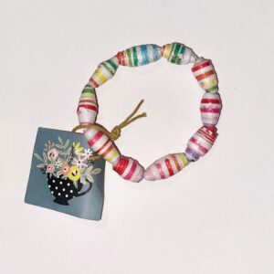 Rainbow Stripes on a paper bead bracelet on a neutral background