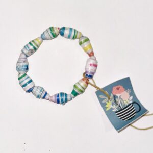 Rainbow Stripe Bracelet #2 on a wooden board showing it fits an 8 inch wrist