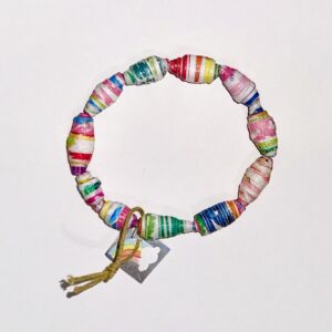 Rainbow Burst Bracelet with bright bold colors and patterns on a neutral brown background