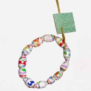 Rainbow Joy Bracelet with flowers and bold geometric shapes with strong colors on a dark neutral background