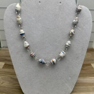 Paper bead necklace of white based pottery look beads with yellow, green and blue specks